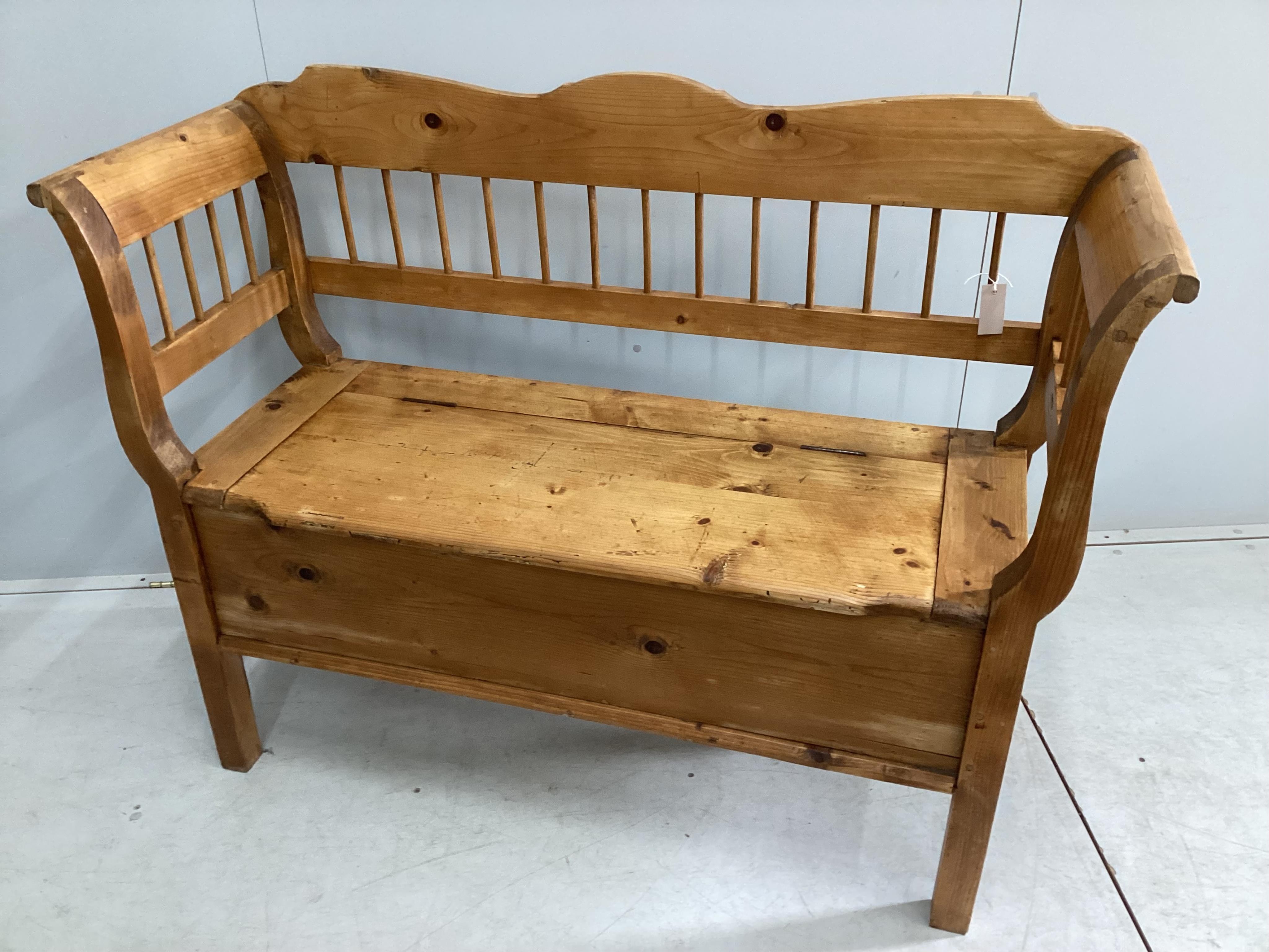 A 19th century Continental pine box seat settle, width 132cm, depth 47cm, height 100cm. Condition - fair to good